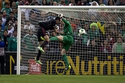 US hangs on for point against Mexico