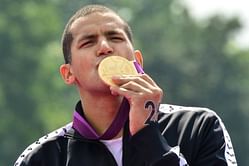 Olympic star Mellouli back in pool, eyes worlds