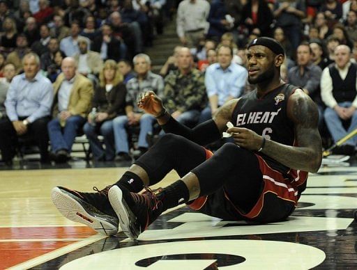 LeBron James of the Miami Heat sits on the court after being fouled by a Chicago Bulls player on March 27, 2013