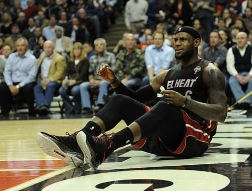 LeBron James of the Miami Heat sits on the court after being fouled by a Chicago Bulls player on March 27, 2013