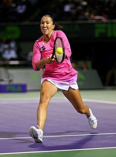 Jelena Jankovic of Serbia plays a backhand to Roberta Vinci at the Miami Masters on March 27, 2013