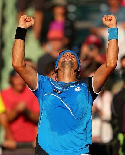 David Ferrer celebrates beating Jurgen Melzer at the Miami Masters on March 27, 2013