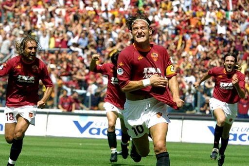 Francesco Totti celebrates after scoring at Rome&#039;s Olympic Stadium, on June 17, 2001