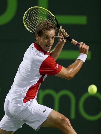 Richard Gasquet plays a backhand against Tomas Berdych in Key Biscayne, Florida, on March 28, 2013