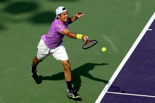 Tommy Haas returns a shot to David Ferrer at the Miami Masters on March 29, 2013