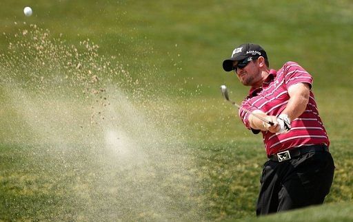 Steve Wheatcroft plays a bunker shot during the second round of the Houston Open on March 29, 2013