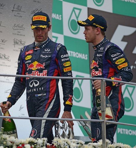 Sebastian Vettel (R) and Mark Webber on the podium after the Malaysia Grand Prix on March 24, 2013