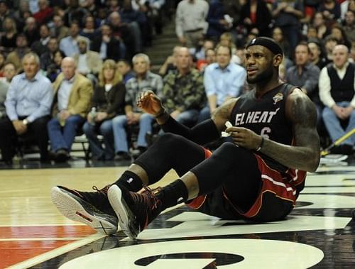 LeBron James of the Miami Heat sits on the court after being fouled on March 27, 2013