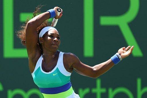Serena Williams returns a shot to Maria Sharapova in the Miami Masters on March 30, 2013