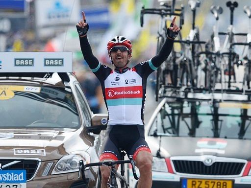 Swiss cyclist Fabian Cancellara celebrates as he crosses the finish line of the Tour of Flanders on March 31, 2013