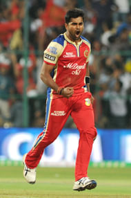 RCB players celebrate fall of wicket during a match between RCB and MI in Bangalore on April 4, 2013. (Photo: IANS)