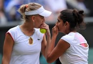 Russian player Elena Vesnina (L) and Indian player Sania Mirza