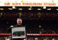 Sir Alex Ferguson is presented with a photo to commemerate his 25th year as manager, as the North Stand is renamed the 'Sir Alex Ferguson Stand' during the Barclays Premier League match between Manchester United and Sunderland at Old Trafford on November 5, 2011 in Manchester, England. (Photo by Richard Heathcote/Getty Images)
