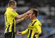 Mario Gotze (R) of of Borussia Dortmund celebrates with Marco Reus after scoring their team's second goal during the UEFA Champions League Group D match between Real Madrid and Borussia Dortmund at Estadio Santiago Bernabeu on November 6, 2012 in Madrid, Spain. (Photo by Denis Doyle/Getty Images)