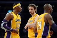 Pau Gasol #16 of the Los Angeles Lakers talks to Dwight Howard #12 and Kobe Bryant #24 during the game. (Getty Images)