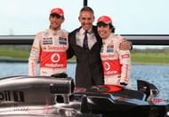 Jenson Button (L) of Great Britain and Sergio Perez (R) of Mexico with team principal Martin Whitmarsh at the unveiling of the Mercedes McLaren MP28 at the McLaren technology centre on January 31, 2013 in Woking, England. (Photo by Mark Thompson/Getty Images)