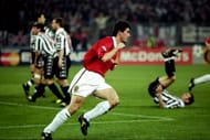 Manchester United captain Roy Keane wheels away after scoring in the UEFA Champions League semi-final second leg match against Juventus at the Stadio delle Alpi in Turin, Italy. United won 3-2 on the night to go through 4-3 on aggregate. Mandatory Credit: Allsport UK /Allsport