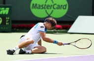 David Ferrer of Spain collapses with cramp on the way to his three set defeat by Andy Murray of Great Britain during their final match at the Sony Open at Crandon Park Tennis Center on March 31, 2013 in Key Biscayne, Florida. (Photo by Clive Brunskill/Getty Images)