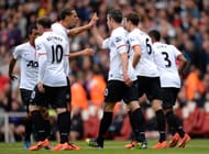 Rio Ferdinand of Manchester United congratulates Robin van Persie of Manchester United after he scored from the penalty spot to make it 1-1 during the Barclays Premier League match between Arsenal and Manchester United at Emirates Stadium on April 28, 2013 in London, England. (Photo by Shaun Botterill/Getty Images)