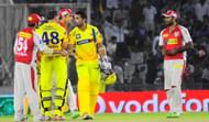 Chennai Super Kings openers Michael Hussey and Murali Vijay being congratulated by Kings XI Punjab players as Chennai Super KIngs won the match by 10 wickets and 16 balls remaining at Mohali stadium in Punjab on April 10, 2013. (Photo: IANS)