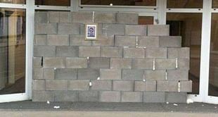 Fans build wall in front of club office to protest