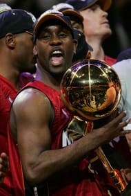 Gary Payton #20 of the Miami Heat holds the Larry O'Brien Trophy after the Heat won the 2006 NBA Finals after defeating the Dallas Mavericks 95-92 on June 20, 2006 at American Airlines Center in Dallas, Texas. NOTE TO USER: User expressly acknowledges and agrees that, by downloading and or using this photograph, User is consenting to the terms and conditions of the Getty Images License Agreement. (Photo by Stephen Dunn/Getty Images)