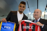 AC Milan's Ghana international Kevin-Prince Boateng (L) poses with FIFA president President Sepp Blatter upon his arrival at the Home of FIFA on March 22, 2013 in Zurich. Boateng, lauded since he walked off a football pitch during a club game in Italy to protest racism abuse by fans met FIFA president. Blatter has raised concerns about players taking matters into their own hands but has since said clubs whose fans are guilty of racial abuse could be either docked points or relegated.