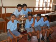 School kids get to touch and pose with the most important trophy in Indian club football