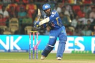 Mumbai Indians player Dinesh Karthik in action during the match with Royal Challengers Bangalore in Bangalore on April 4, 2013. (Photo: IANS)