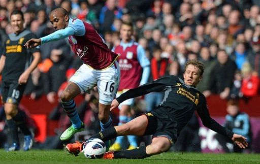 Aston Villa&#039;sFabian Delph (left) vies with Liverpool&#039;s Lucas Leiva at Villa Park in Birmingham on March 31, 2013