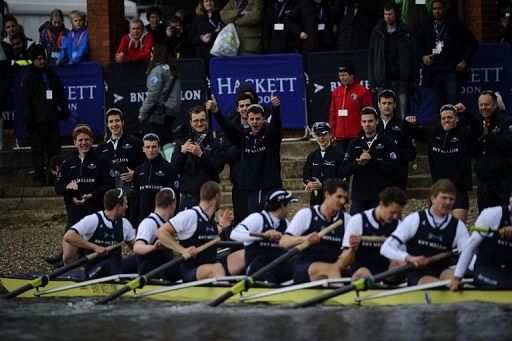 The Oxford University boat crew celebrate after beating Cambridge during the annual boat race, London, March 31, 2013