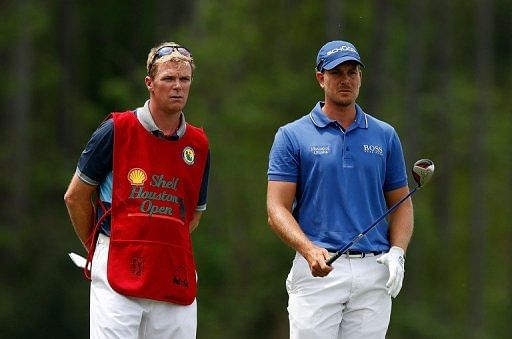 Henrik Stenson chats with his caddie on the eighth hole at the Shell Houston Open on March 31, 2013 in Humble, Texas