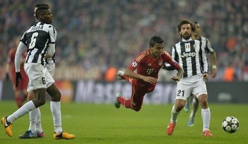 Midfielder Luiz Gustavo takes a tumble during the Champions League quarter-final home to Juventus on April 2, 2013 Midfielder Luiz Gustavo takes a tumble during the Champions League quarter-final home to Juventus on April 2, 2013