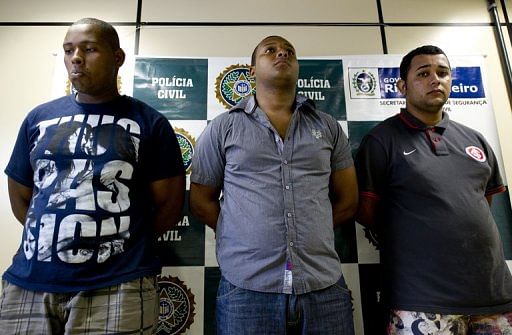 The three men who allegedly raped an American student are presented to the press in Rio on April 2, 2013