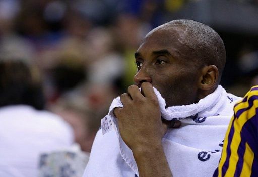 Kobe Bryant sits on the bench during the game against the Golden State Warriors on March 25, 2013