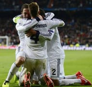 Real Madrid's Gonzalo Higuain (L) celebrates next to Raphael Varane (R) and Sergio Ramos on April 3, 2013 in Madrid