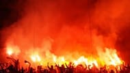 Galatasaray's supporters light flares on April 3, 2013 at Santiago Bernabeu stadium in Madrid