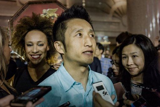 Two-time Olympic champion Zou Shiming talks to the media in Hong Kong on March 27, 2013