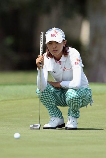 Na Yeon Choi of South Korea lines up a putt during the first round of the Kraft Nabisco Championship on April 4, 2013