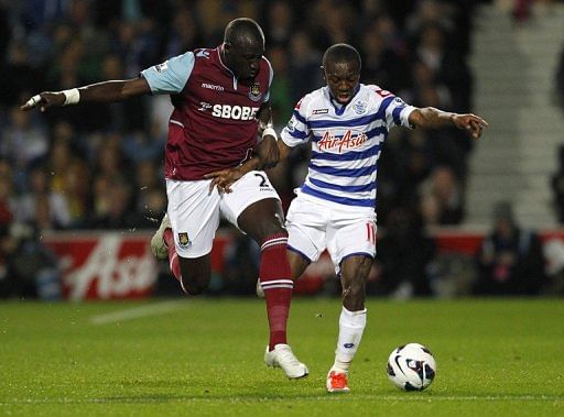 Mohamed Diame vies with Shaun Wright-Phillips (right) during a Premier League match in London on October 1, 2012