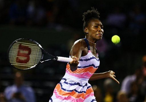 Serena and Venus Williams, pictured in action last month, won Friday in Charleston to book a semi-final showdown