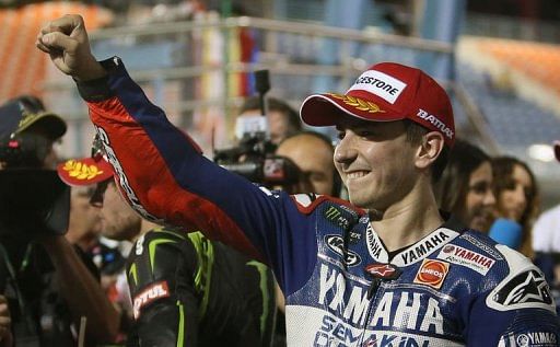 Yamaha MotoGP rider Jorge Lorenzo of Spain celebrates after taking the pole position, April 6, 2013 in Doha