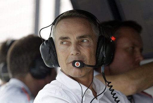 McLaren team principal Martin Whitmarsh looks back from the pit wall in Noida, on October 27, 2012