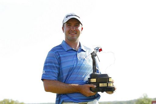 Martin Laird holds the trophy after winning the Valero Texas Open on April 7, 2013