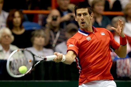 Novak Djokovic returns a shot to Sam Querrey during the Davis Cup tie at Taco Bell Arena in Boise on April 7, 2013