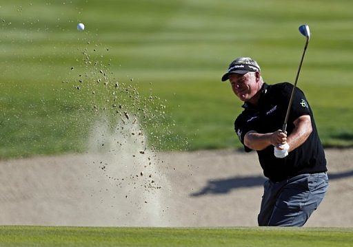 Darren Clarke plays a shot at the Abu Dhabi Golf Club in the Emirati capital on January 18, 2013