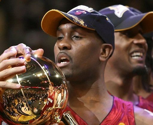 Gary Payton of the Miami Heat holds the Larry O&#039;Brien trophy on June 20, 2006