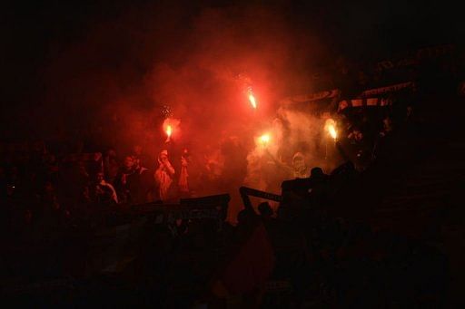 AS Roma supporters cheer their side before the Serie A football derby against AS Roma on April 8, 2013