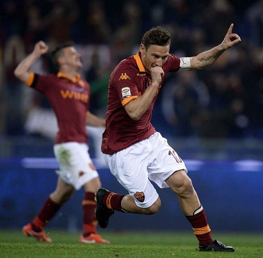 AS Roma&#039;s Francesco Totti celebrates after scoring on April 8, 2013 at the Olympic stadium in Rome