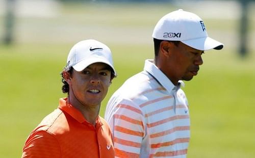 Rory McIlroy walks alongside Tiger Woods on March 8, 2013 in Doral, Florida